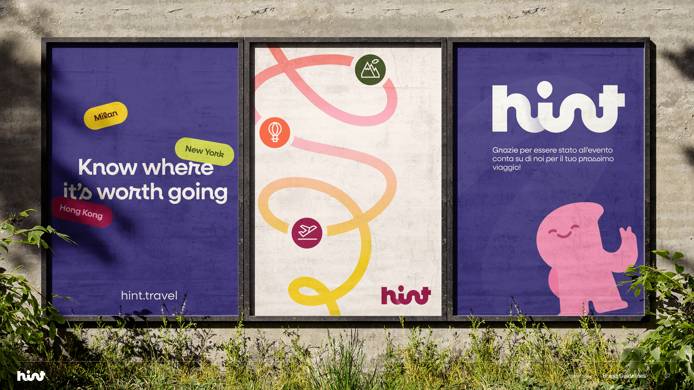 Three Hint street posters on a concrete wall: Know where it’s worth going, a looping travel route, and the wordmark with the mascot
