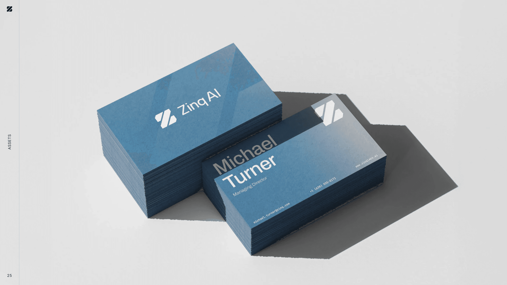 Brand guide assets: steel blue business cards with the Z mark and a placeholder name